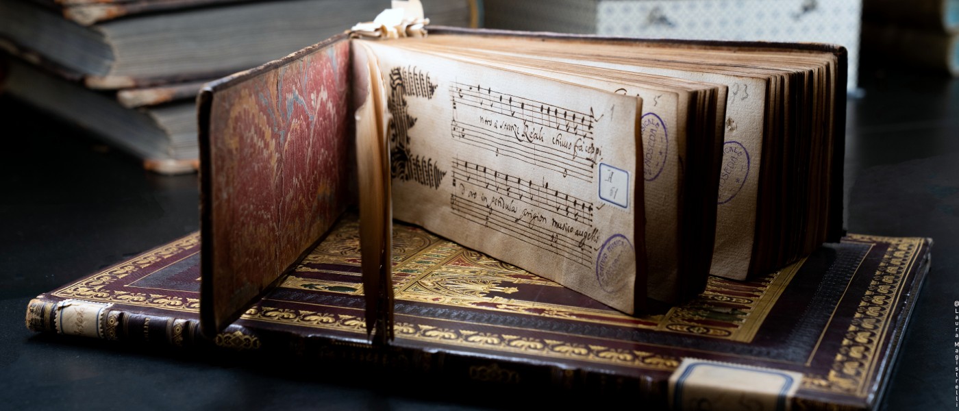 Manuscript collection of cantatas lying open on a gold-tooled morocco binding